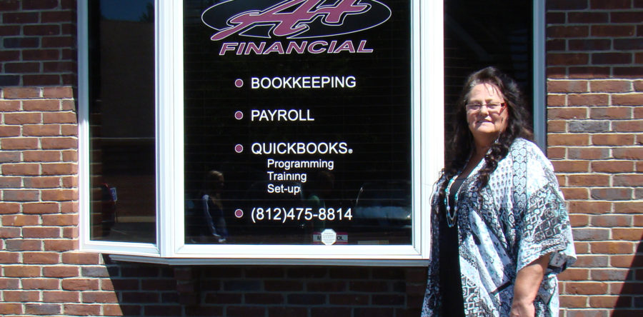 Lori posing in front of office